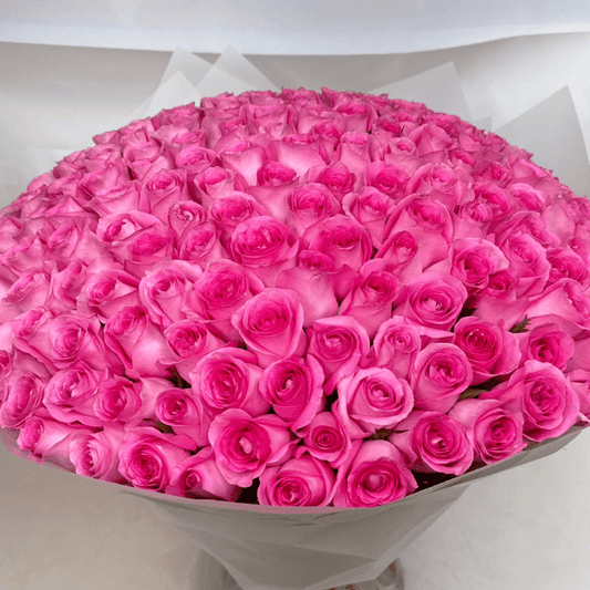 100 premium pink roses hand-tied into a grand romantic bouquet by Goshen Flower in Dubai