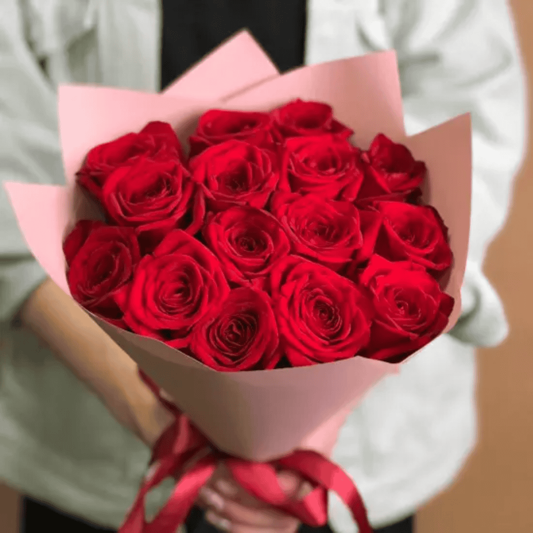 Fifteen red roses arranged into a hand-tied romantic bouquet by Goshen Flower in Dubai. Classic floral gift for love and passion.