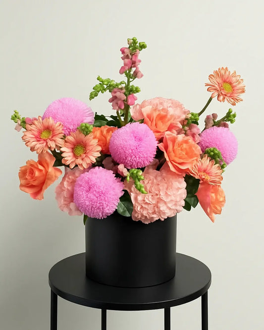 Midnight Bloom luxury black flower box with pink chrysanthemums, peach roses, and hydrangeas dubai