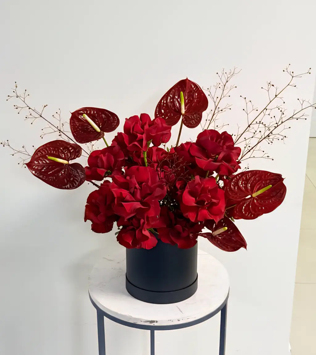 Moscow Bouquet with deep red roses and striped anthuriums — flower delivery Dubai