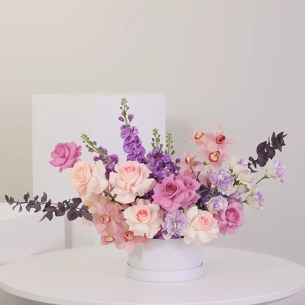 Noor Blossom Box – luxury flower arrangement with roses and orchids in a white box, available for same-day delivery in UAE