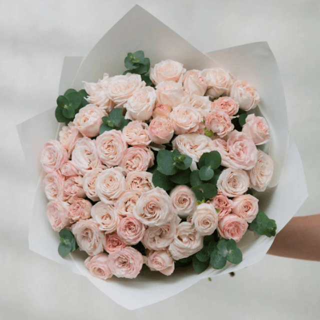 Petite bouquet of pink baby roses, handcrafted by Goshen Flower in Dubai. Ideal for new baby gifts and sweet surprises.
