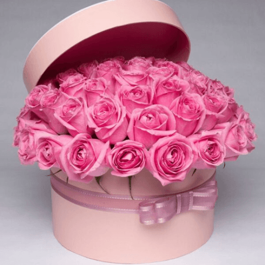 Luxury pink rose box arrangement, handcrafted by Goshen Flower in Dubai. Elegant floral gift box with fresh pink roses.