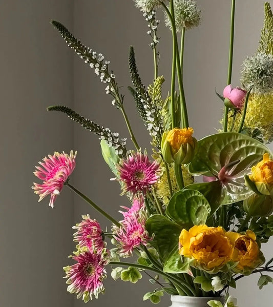 Royal Bloom luxury flower arrangement with red and white blooms in ceramic vase – premium flower delivery in Dubai