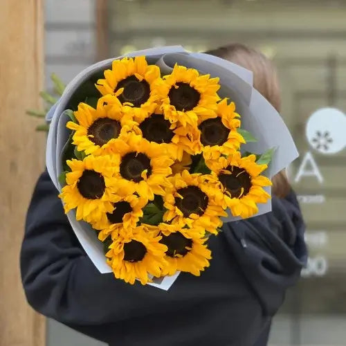 Hand-tied sunflower gift arrangement with greenery in Dubai