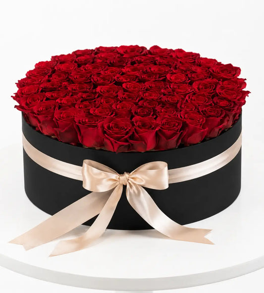 100 red roses in black luxury hat box with champagne ribbon Dubai gift