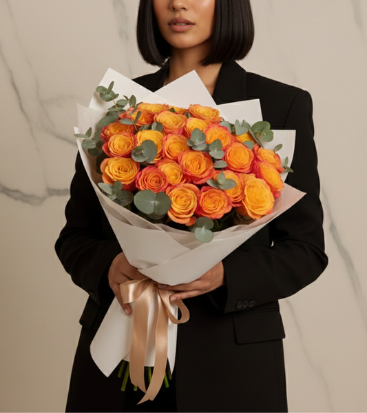 Orange roses delivery Dubai — 24 vibrant tangerine orange roses in a luxury satin gift box, same-day flower delivery across Dubai and UAE
