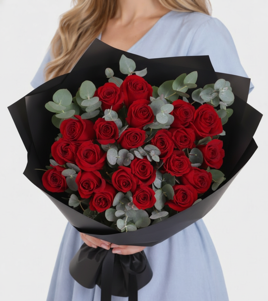 Order red roses Dubai — 24 premium crimson roses in a luxury satin gift box with silk ribbon, same-day flower delivery across Dubai and UAE