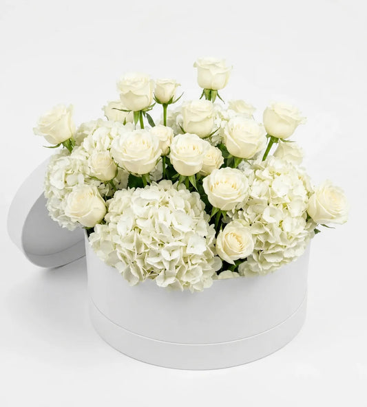 White hydrangea and rose sympathy box arrangement Dubai — condolence flowers by Goshen Flower