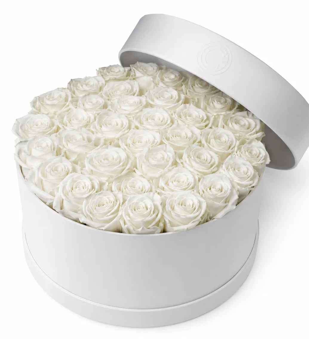 White rose sympathy hatbox arrangement Dubai — signature condolence flowers by Goshen Flower