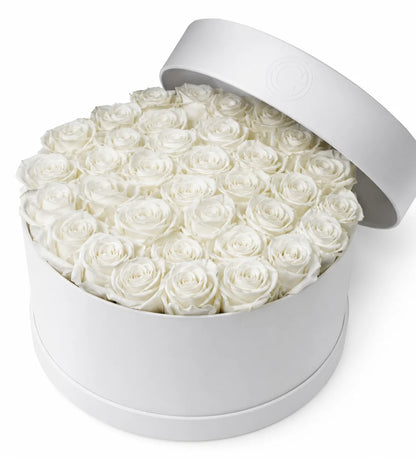 White rose sympathy hatbox arrangement Dubai — signature condolence flowers by Goshen Flower