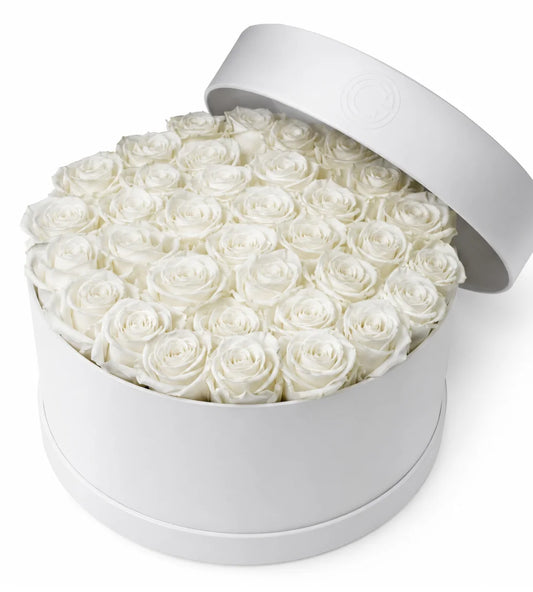White rose sympathy hatbox arrangement Dubai — signature condolence flowers by Goshen Flower