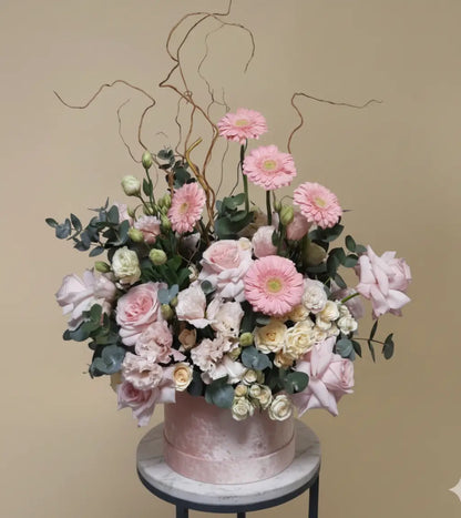 Blush Elegance Grandeur Box with peach roses, blush orchids, white blooms in beige hatbox, available for same day flower delivery in Dubai