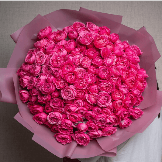 Elegant pink peony and rose bouquet with lush greenery, handcrafted by Goshen Flower. Luxury flower delivery in Dubai.
