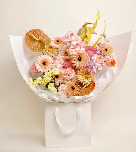 Creamy yellow calla lilies adding soft curves to the Golden Hour Glow sunset palette