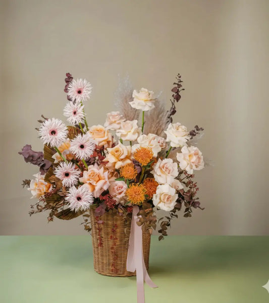 Heaven Paradise Basket with peach roses, pink gerberas, pampas and foliage – luxury flower basket by Goshen Flower Dubai