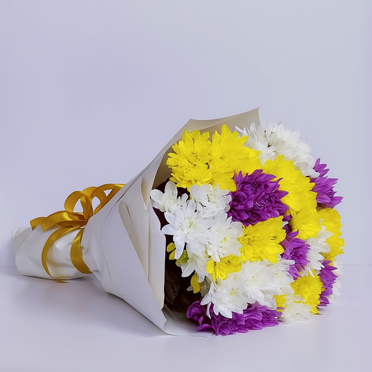 Mixed chrysanthemum bouquet with white, yellow, and purple blooms, hand-arranged by Goshen Flower in Dubai.