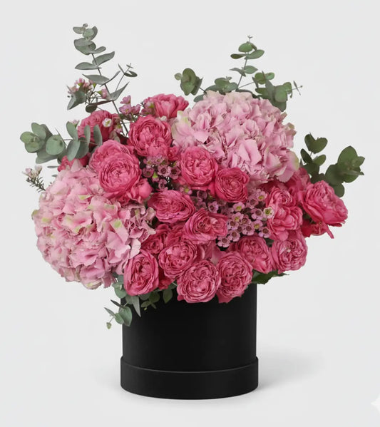 Luxury pink hydrangea and roses arranged in elegant hatbox, Dubai premium flower delivery by GOSHEN FLOWER