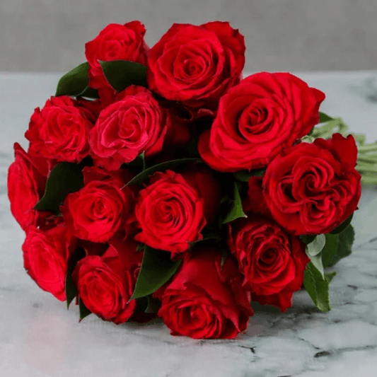 Scarlet Kiss – A hand-tied bouquet of 15 velvety red roses, crafted for romantic moments in Dubai.