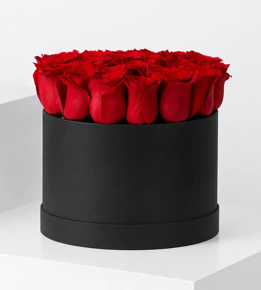 30 red roses matte black medium hat box champagne ribbon luxury flowers Dubai