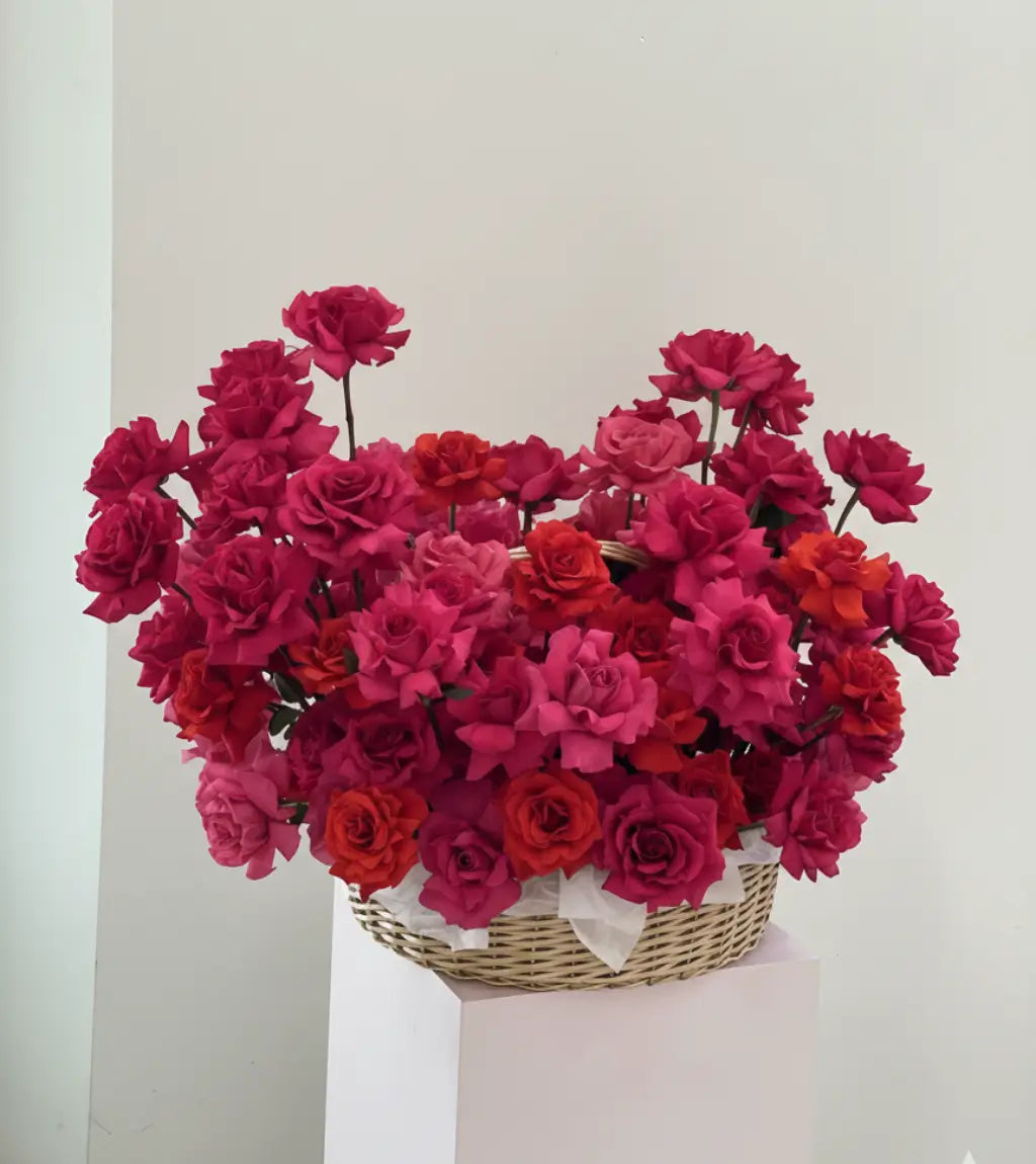 Rose Couture Basket with premium pink and red roses arranged in a luxury woven basket – flower delivery Dubai