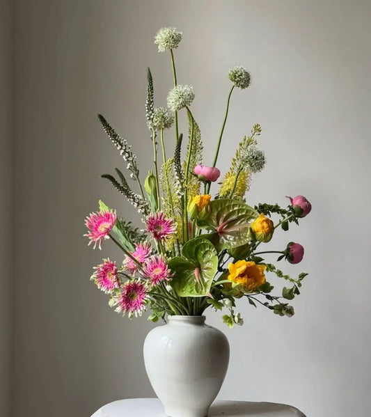 Royal Bloom luxury flower arrangement with red and white blooms in ceramic vase – premium flower delivery in Dubai and UAE