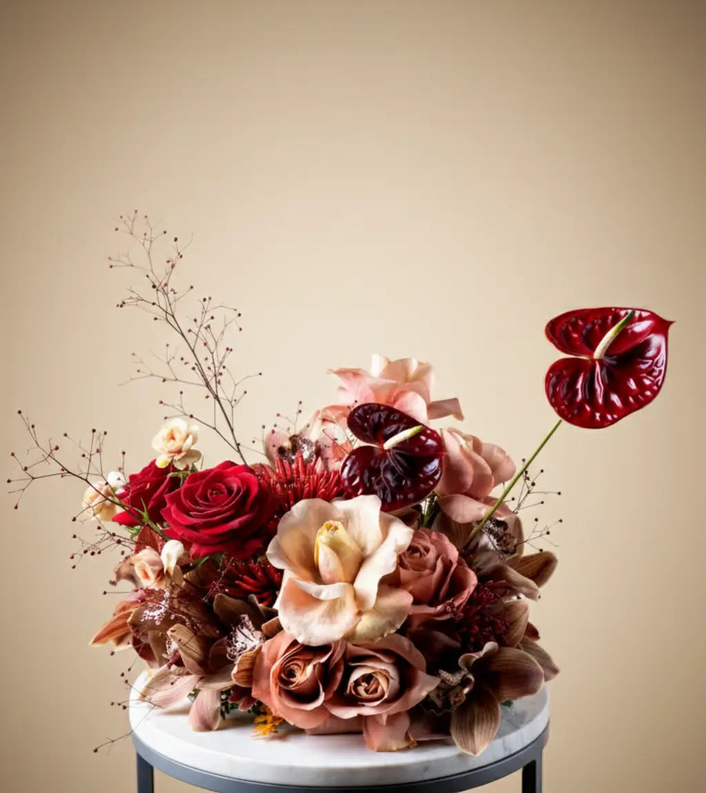 Royal Elegance Floral Centerpiece with red anthuriums and blush roses in a luxury table arrangement in Dubai