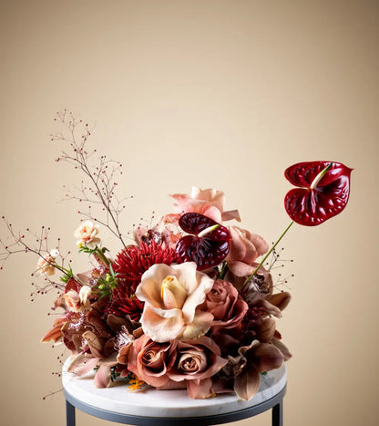 Royal Elegance Floral Centerpiece with red anthuriums and blush roses in a luxury table arrangement in Dubai
