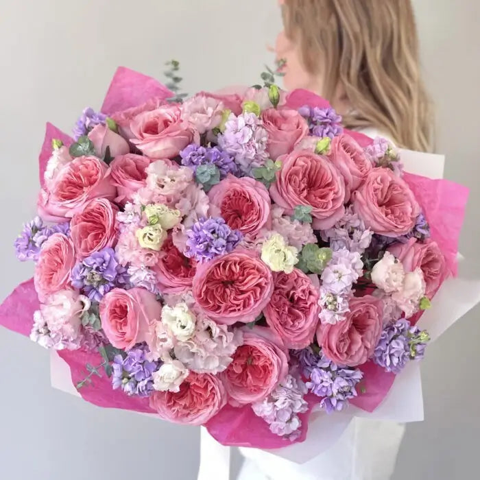 Velvet Berry bouquet with garden roses, stock flowers, lisianthus, and eucalyptus – flower delivery Dubai