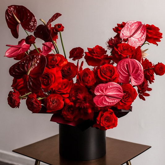Luxury red rose and anthurium flower arrangement in black hatbox – Velvet Rouge – same-day flower delivery Dubai