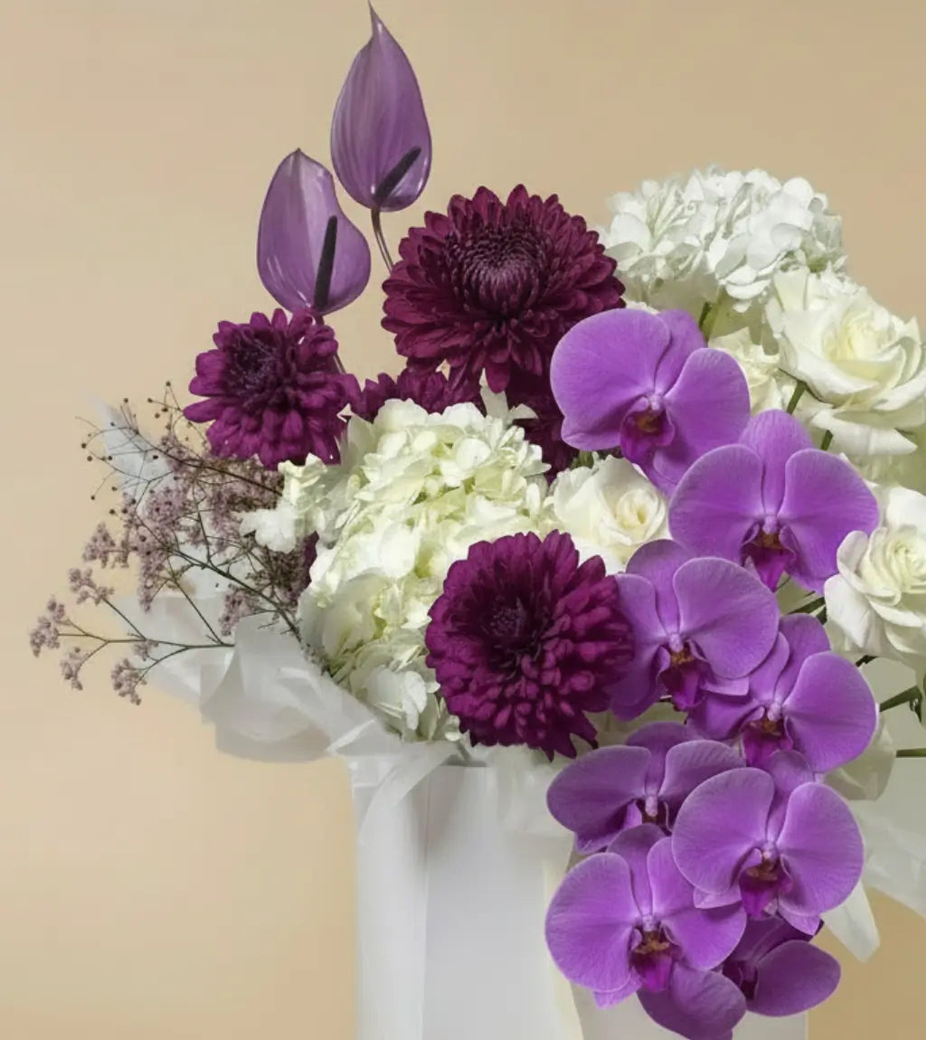 Close-up of Violet Reverie bouquet showing purple orchid blooms and white spray roses — premium flower gift arrangement available in Dubai