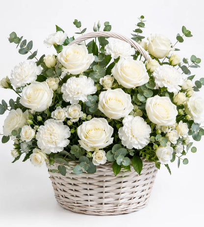 White flower basket arrangement Dubai — condolence flowers delivered by Goshen Flower