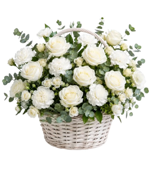 White sympathy flower basket arrangement Dubai — condolence flowers delivered by Goshen Flower