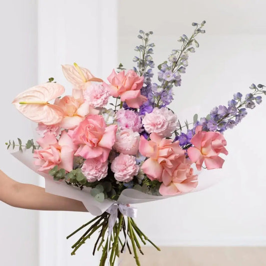 Wow Bouquet with pastel roses, anthuriums, delphinium, and eucalyptus – flower delivery Dubai